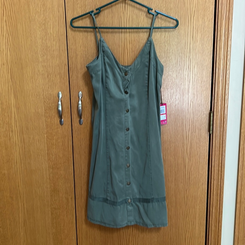 Brand new Vince Camuto XS olive green dress. Fits like a 4. Classy. Strappy